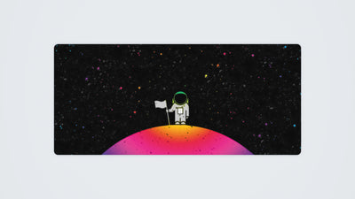 900 x 400 mm custom gaming mouse mat with a cartoon astronaut standing on a planet, in a spectrum of dark and RGB colours